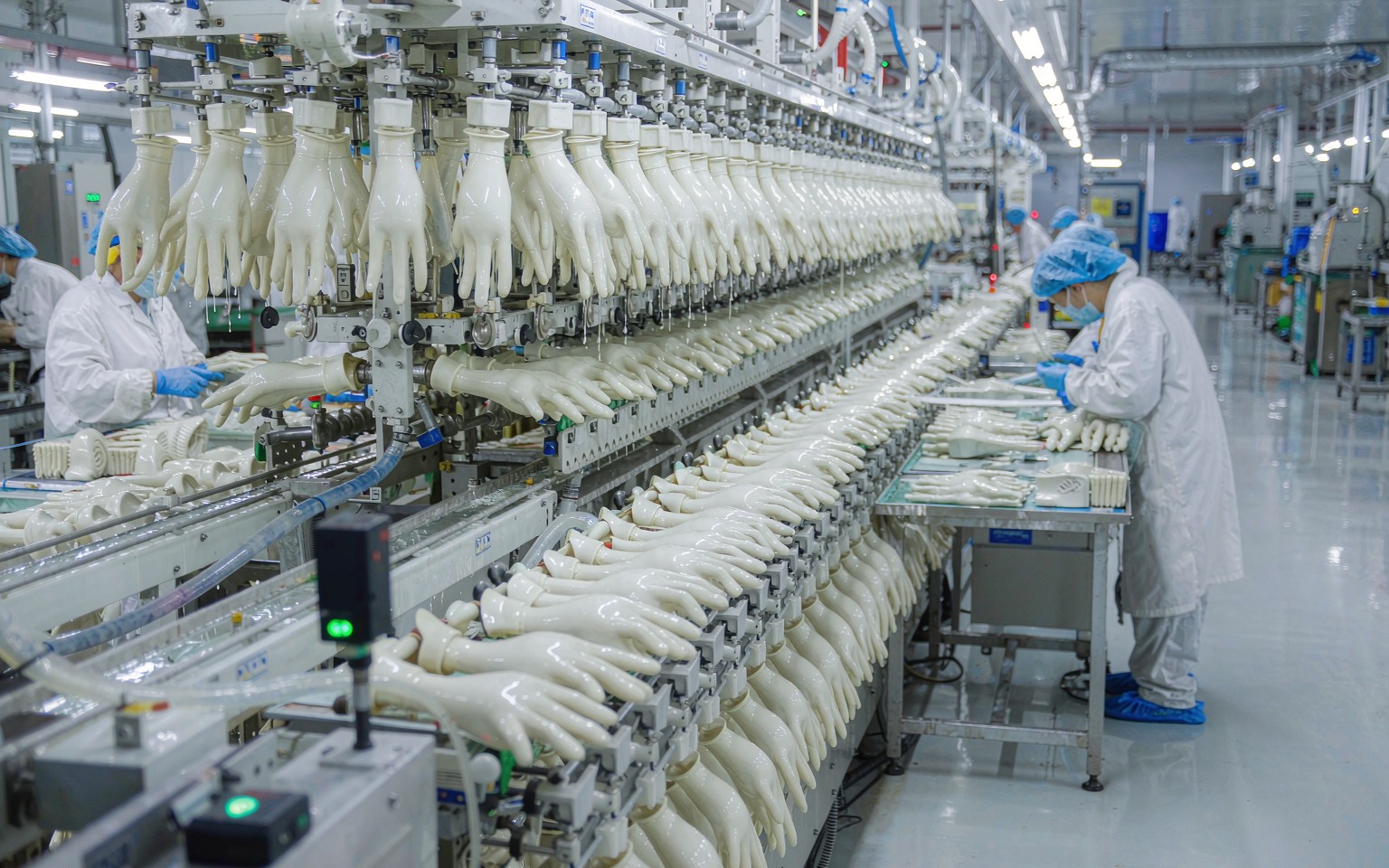 Rows of hand-shaped formers on an automated surgical glove dipping line